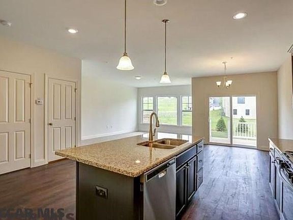 Home under construction. Completed home pictured.