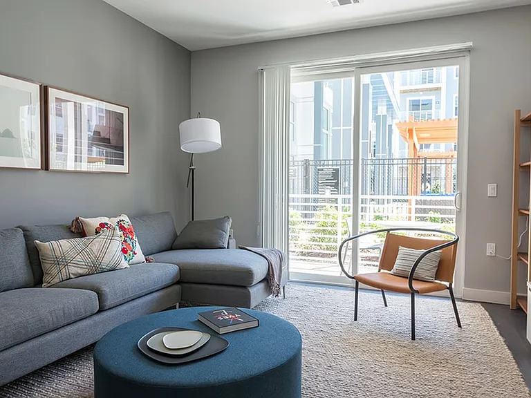 Floor to ceiling windows and access to private patio