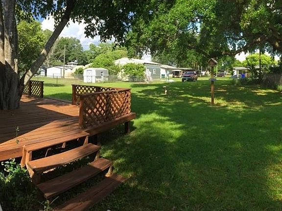 Open Porch side view with back yard.
