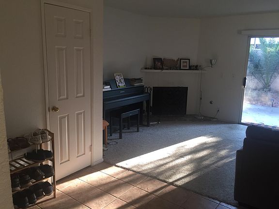 View of the living room from the kitchen. Gas fireplace with