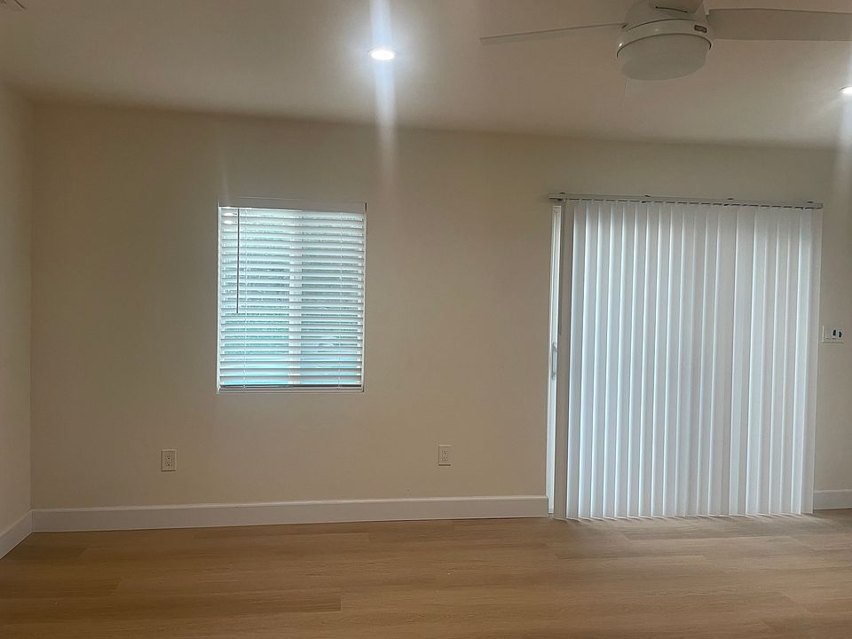 Sliding glass door to backyard, just steps to pool.