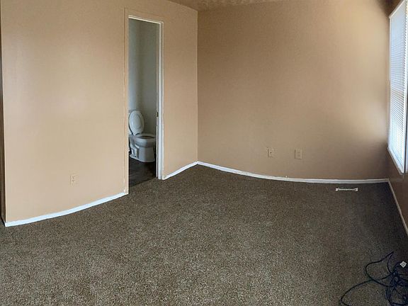 Bedroom 4 on 3rd floor with half bath and walk in closet near door