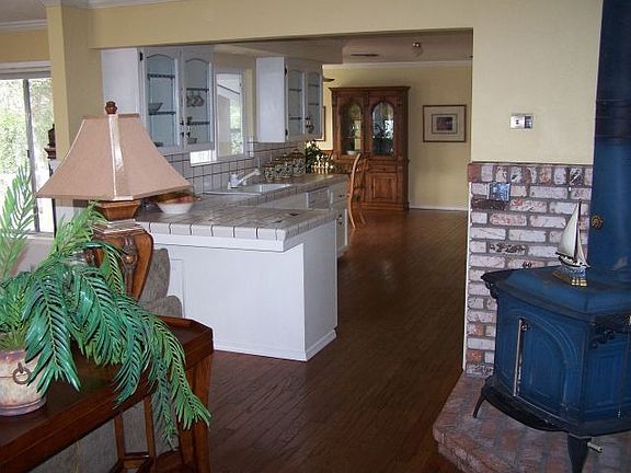 Bruce wood flooring, carpeted living room 