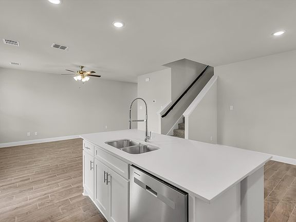 Kitchen looking into Living and Dining