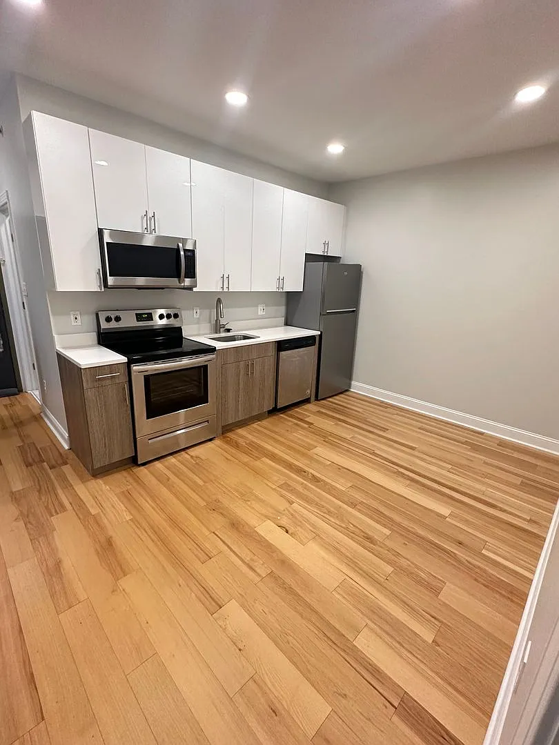 1-bedroom with a bay window and refinished hardwood — Photo 1