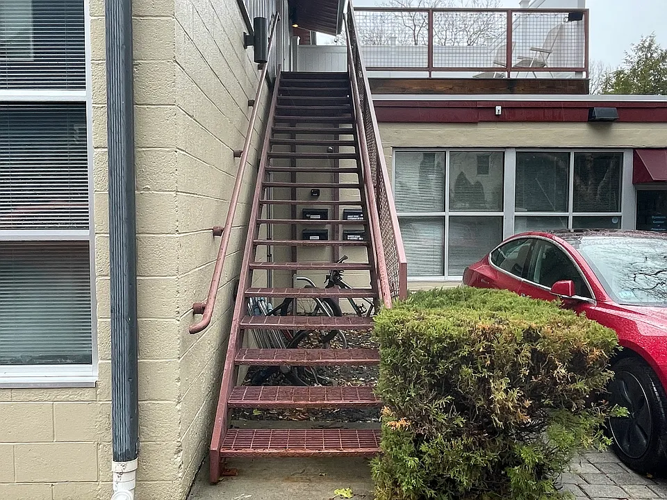 Stairs to deck (new installed 2022). All mailboxes are located below the stairs as well.