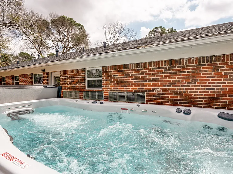15 ft swim spa that produces a current to swim against and therapeutic jets on one side. The water can be heated up to 104 degrees for year round use.