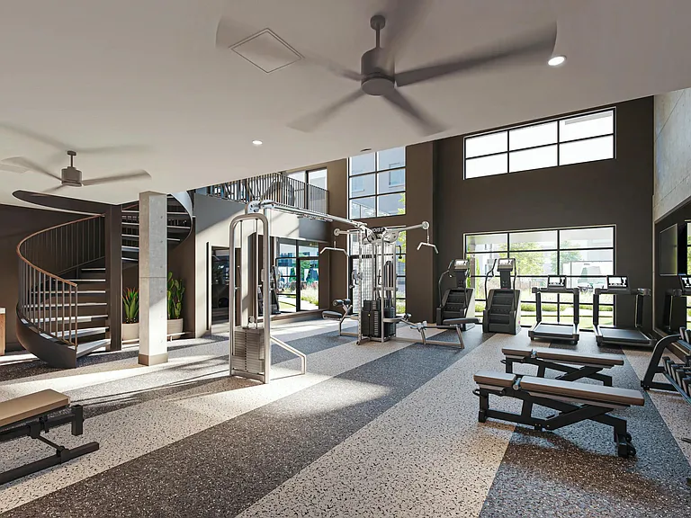 A bright, open fitness studio with cardio, strength training, and room to move.