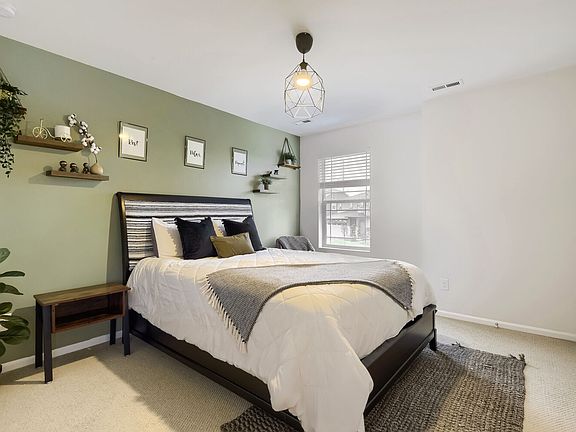 One of 4 bedrooms upstairs with a walk-in closet