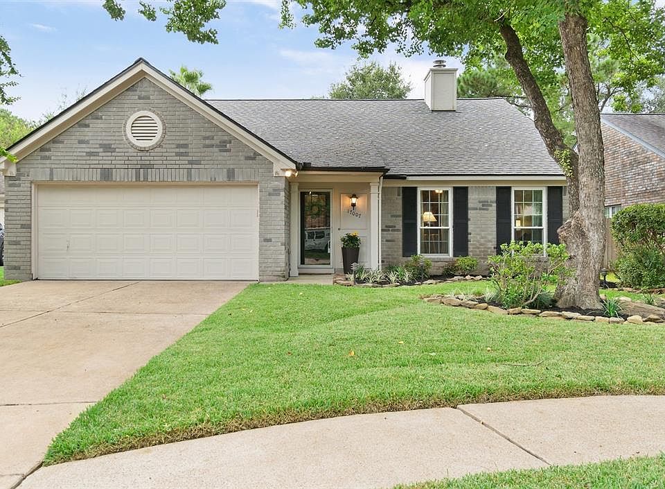 Welcome to your dream home at 17007 Fordingbridge Drive in the quiet, tree-lined neighborhood of Memorial Chase.