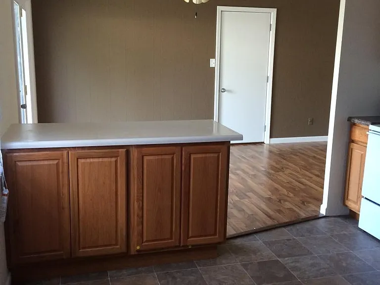 Please note: photos were taken prior to renovation. New luxury vinyl plank flooring, fresh paint throughout, new stainless steel appliances, and a new peninsula countertops are currently being installed.