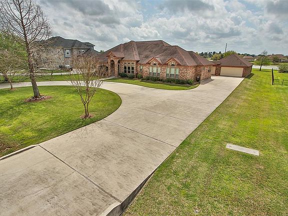 Plenty of driveway space leads to the 4 car garage tucked neatly behind the home.
