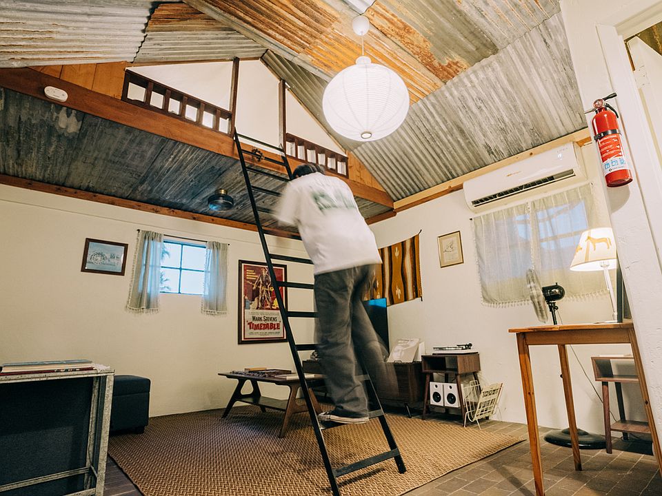 Loft-style studio, ladder leads to bedspace