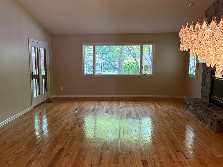 Looking from dining room to living room. nice view from picture window.