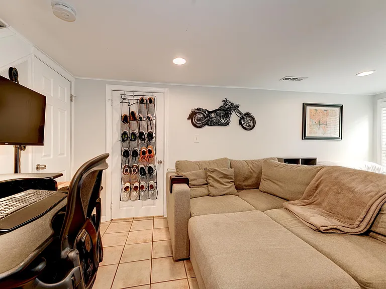 Living Room has large window and space for desk and sofa!