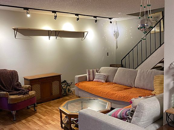 Living Area. As a reminder I still live here and there will be less decorative things once you move in. Please just focus on the layout and furniture.