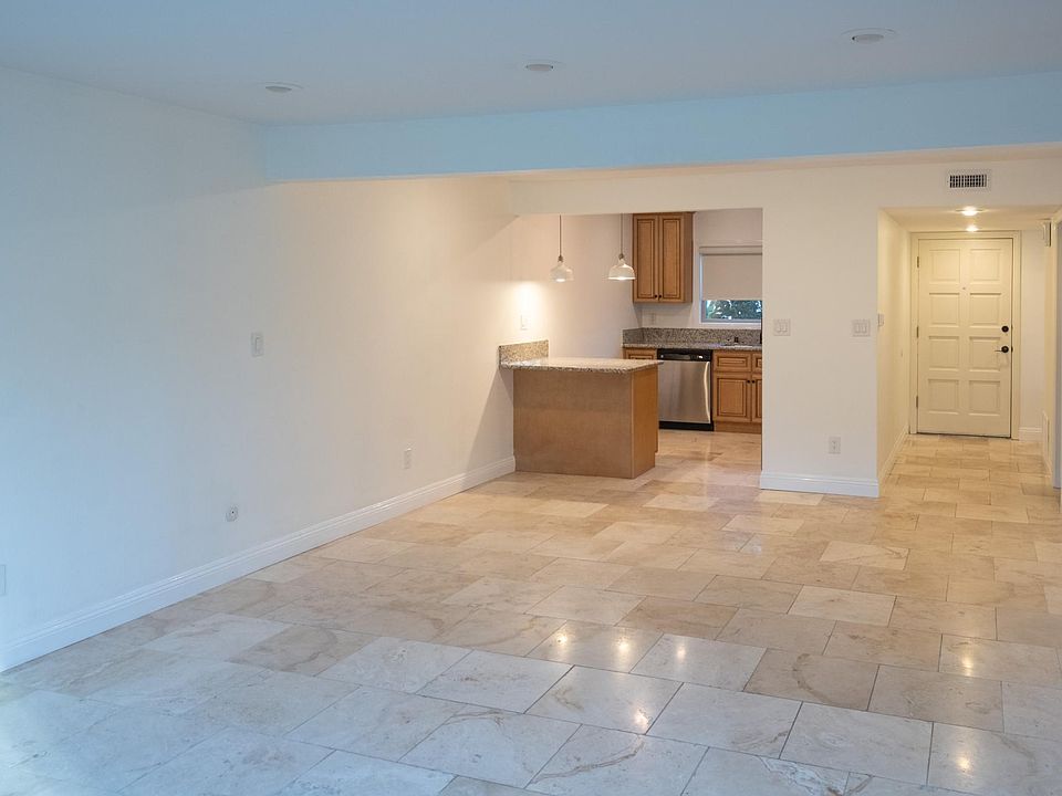 Living room, kitchen, and front entry