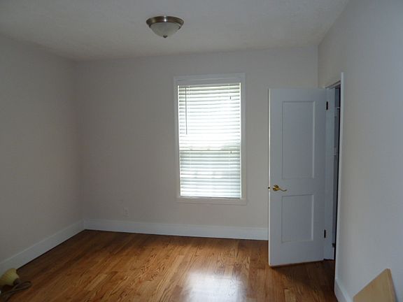 bedroom 1 with hardwoods