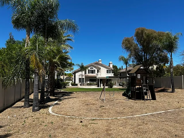 back yard with child play house, can be removed
