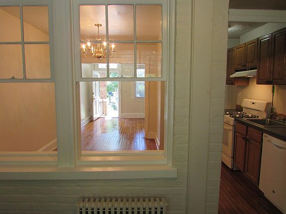 View from enclosed back porch toward the front of house and kitchen