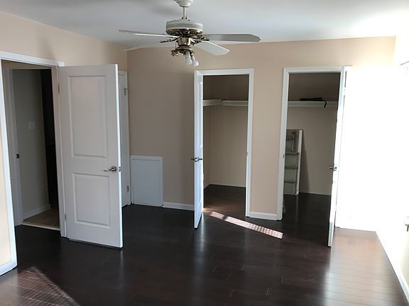 master bed room with walk in closets