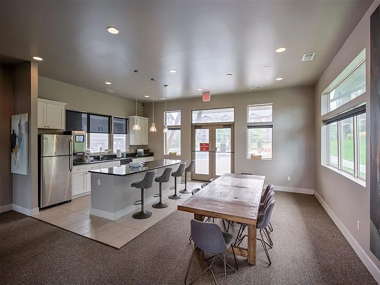 Community kitchen with pool area entrance in clubhouse at Avenue 204.