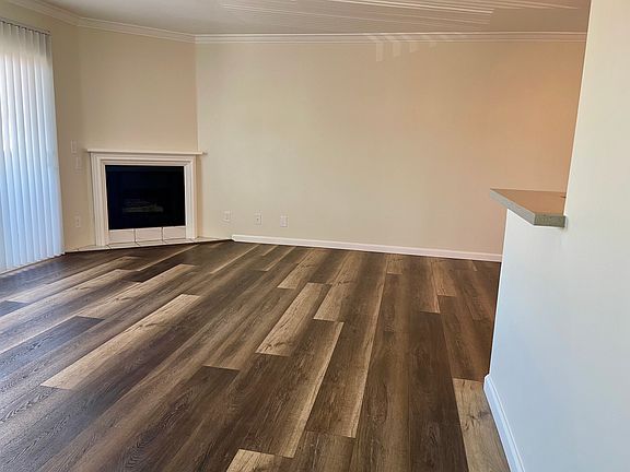 living room w/fireplace and balcony