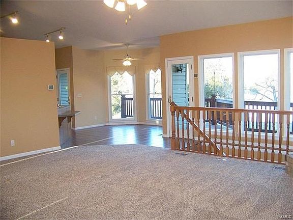 The great room flows into the breakfast room that has large bay windows so you can overlook the lake and your backyard while you have coffee.