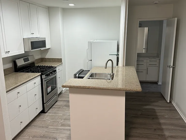 Kitchen and hallway to bedroom