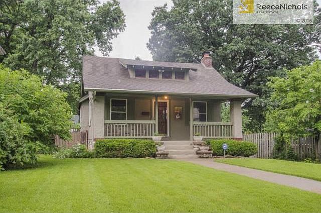 Adorable Airplane Bungalow with spacious covered porch and stucc