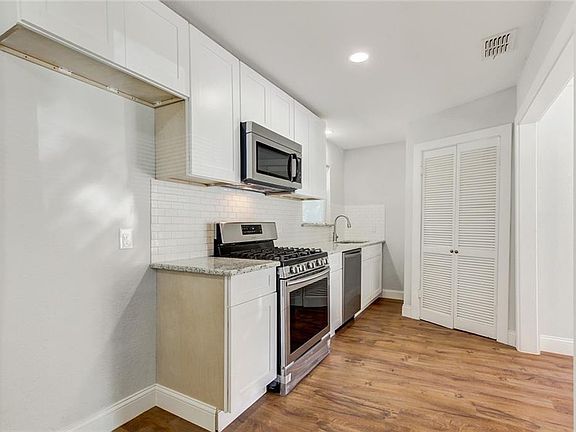 This brand new kitchen has new appliances, fixtures & tile work. Perfect for entertaining friends.