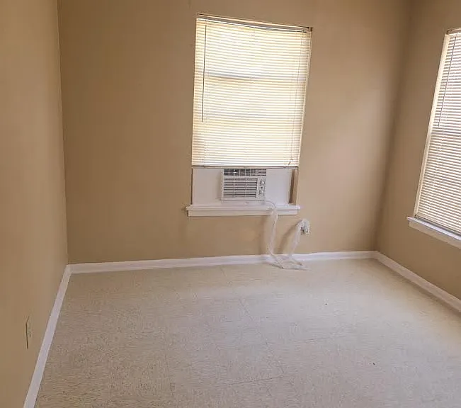 Kitchen and bedrooms have window a/c for affordable comfort, including this new window unit.