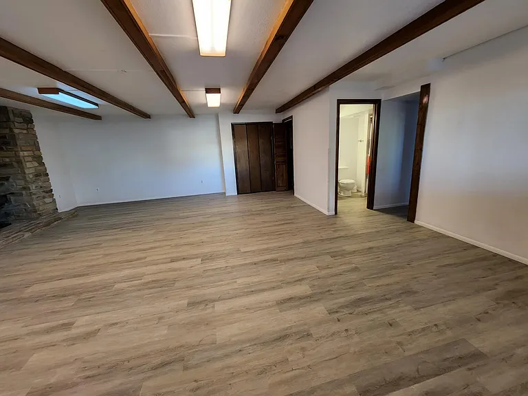 Large lower bedroom or family rec room with shower bath