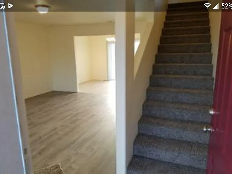 Modern design staircase with opening to living room