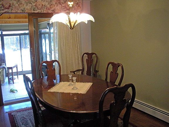 Dining room with siders to 4 season room with spa