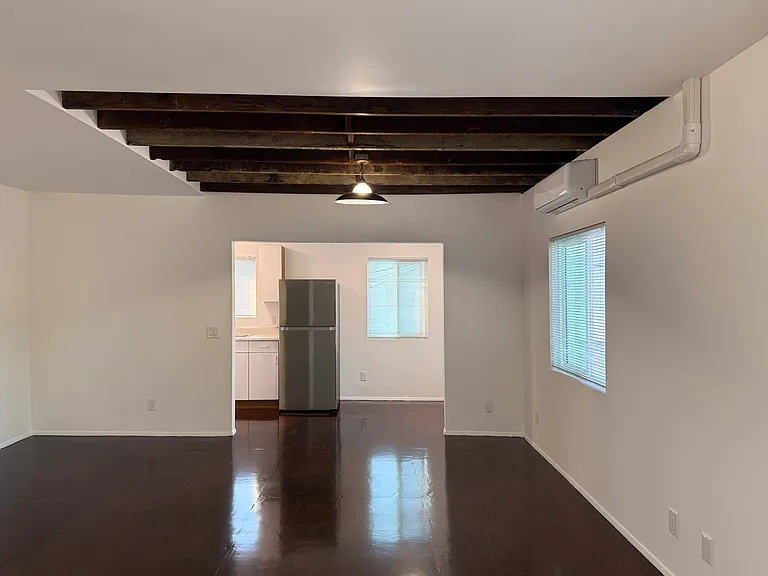 Loft style apartment with open kitchen and bedroom spaces.