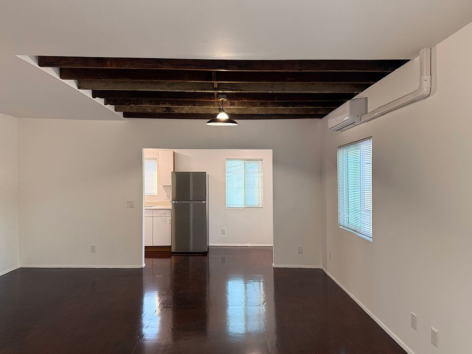 Loft style apartment with open kitchen and bedroom spaces.