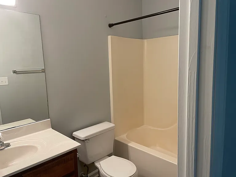 The ensuite bath has a large vanity and a handy tub/shower unit.