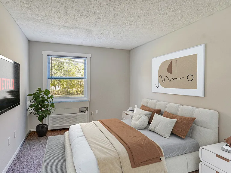 Unveil a new standard of living at Village Apartments at Summitville, where modern elegance meets comfort. This inviting bedroom offers serene views and ample natural light for relaxation. Elevate your lifestyle today-schedule a tour and see it for yourse