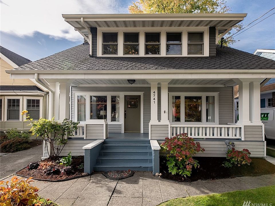 Idyllic covered from porch welcomes you home.  Roof is just a few years old. 