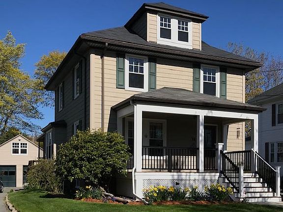 Front of house with detached garage