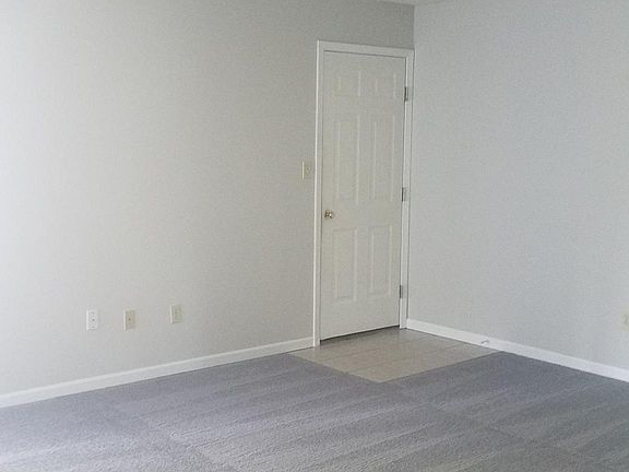 Living room. Door to garage.