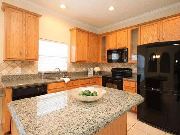 Kitchen Island with granite.  New stainless steel appliances