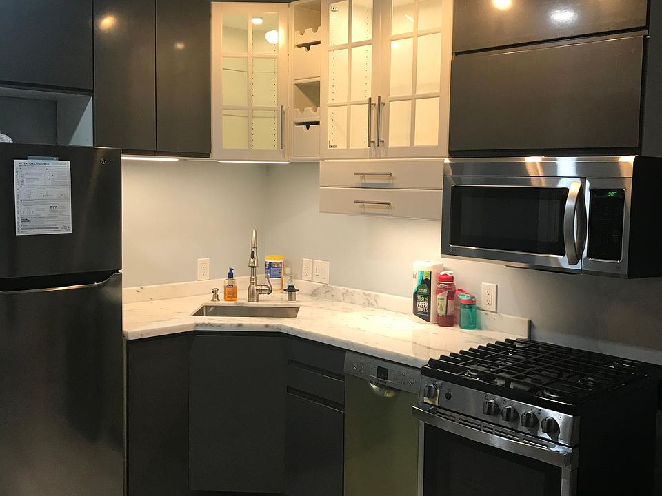 Gourmet full kitchen with high end appliances, dimmable LED under cabinet lights.