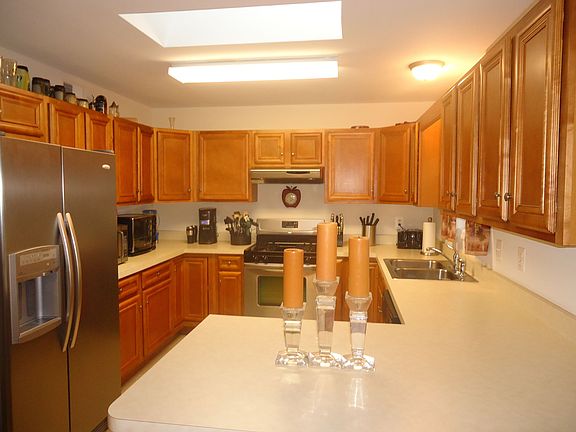 Kitchen - 10 x 9; skylight, oak cabinets, stainless appliances