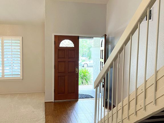 Double door entry and hardwood stairs