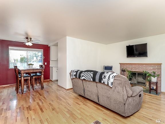 Original hardwood floors in living, dining, hall and 3 bedrooms! Wood burning fireplace to cozy up to on cold winter nights!