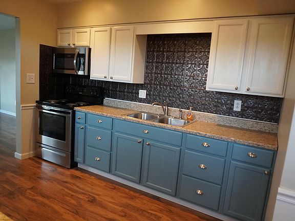 Plenty of cabinet space with a back splash
