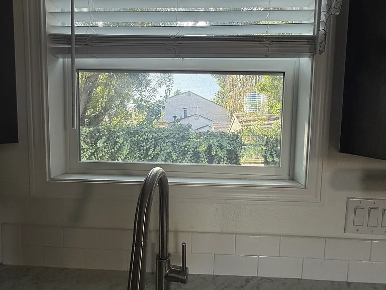 View from kitchen into the private /fenced yard