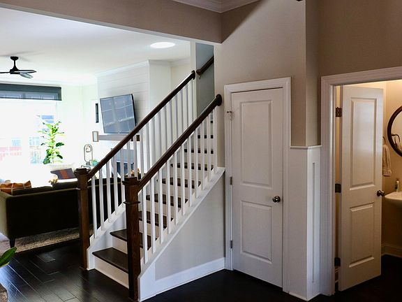 Coat closet and powder room in foyer.